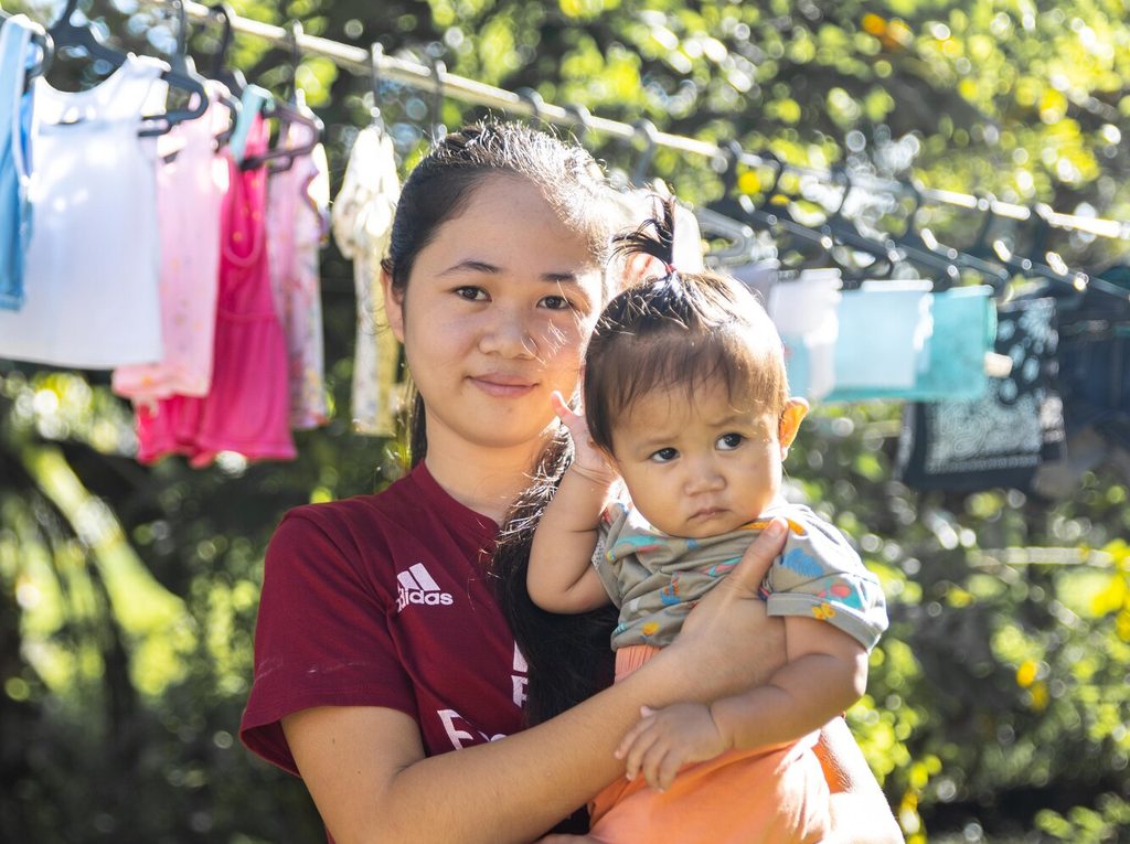 Pictured: Gwyn, 19, from Philippines, with her baby Lesha.